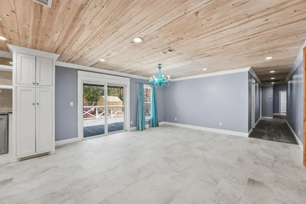 a view of an empty room and a window