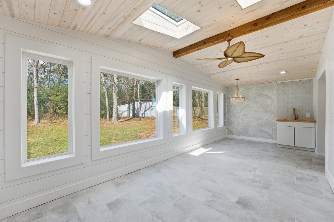 2920 Superior Road Magnolia, TX 77354 - Photo 9 of 46 a view of an empty room with a window and chandelier