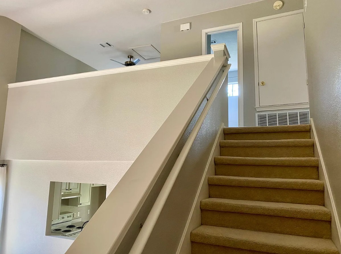 2120 Jester Farms Road Round Rock, TX 78664 - Photo 18 of 28 Carpeted staircase leading to a functional upper-level landing, offering versatile living space.