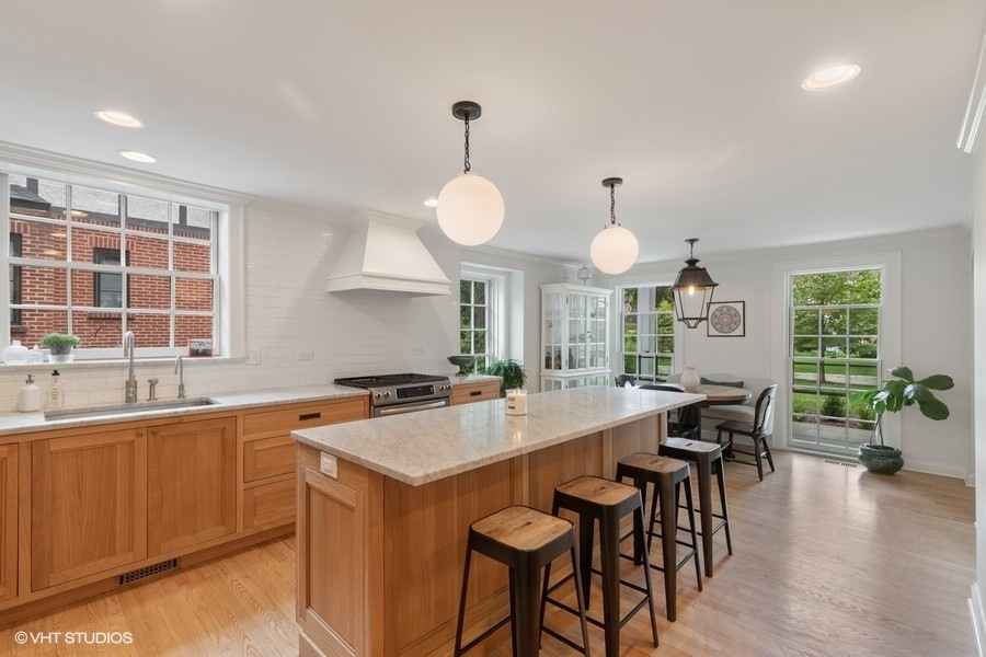 162 Maplewood Road Riverside, IL 60546 - Photo 12 of 44 a large kitchen with a table and chairs