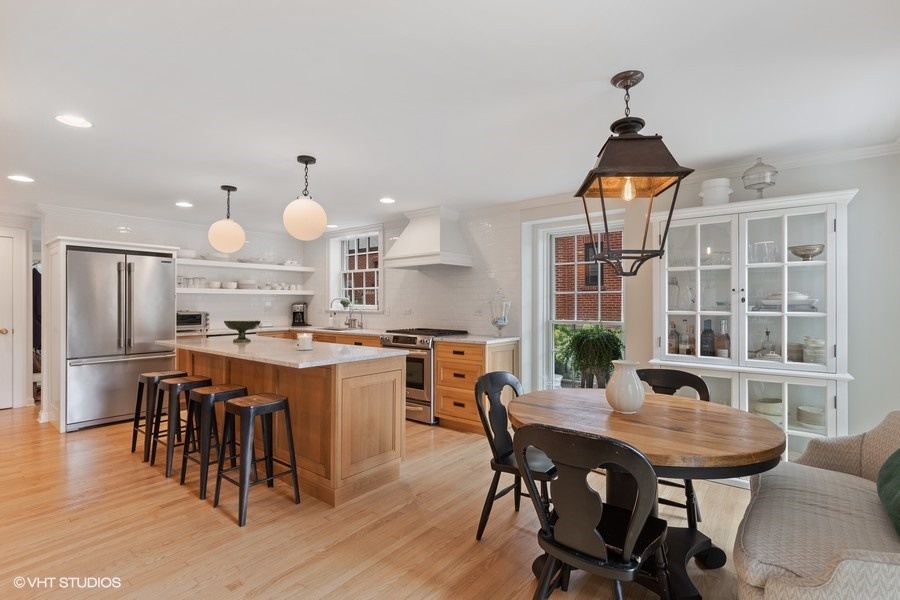 162 Maplewood Road Riverside, IL 60546 - Photo 19 of 44 a kitchen with a dining table chairs and refrigerator