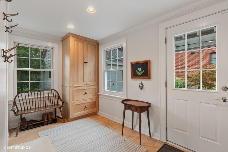 162 Maplewood Road Riverside, IL 60546 - Photo 23 of 44 a view of a hallway with wooden floor and a window