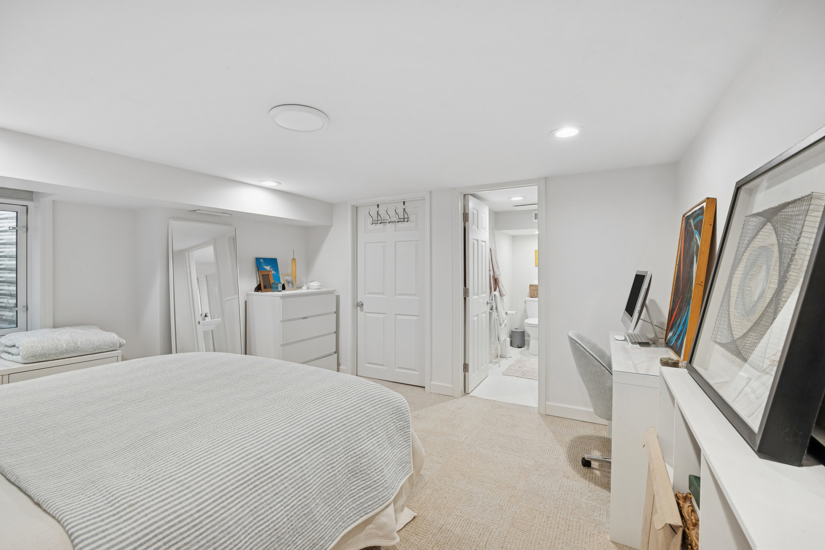 162 Maplewood Road Riverside, IL 60546 - Photo 38 of 44 a spacious bedroom with a bed and a flat screen tv