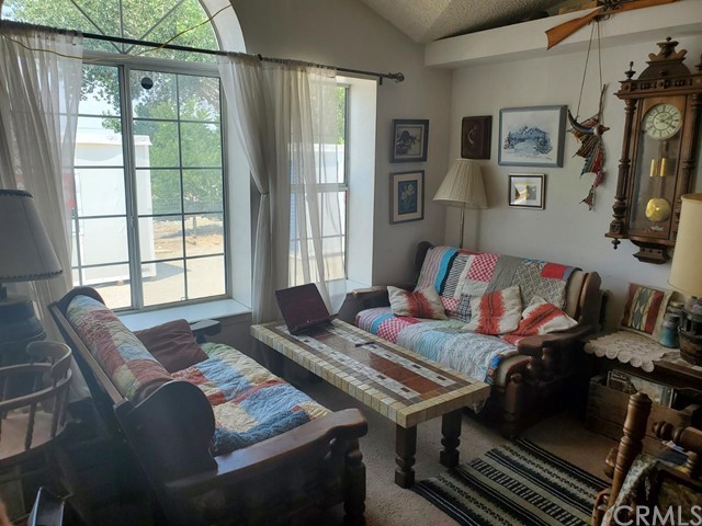 12285 Golden View Road Pinon Hills, CA 92372 - Photo 18 of 33 a living room with furniture and a window