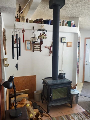 12285 Golden View Road Pinon Hills, CA 92372 - Photo 20 of 33 a view of hall way with furniture and rug