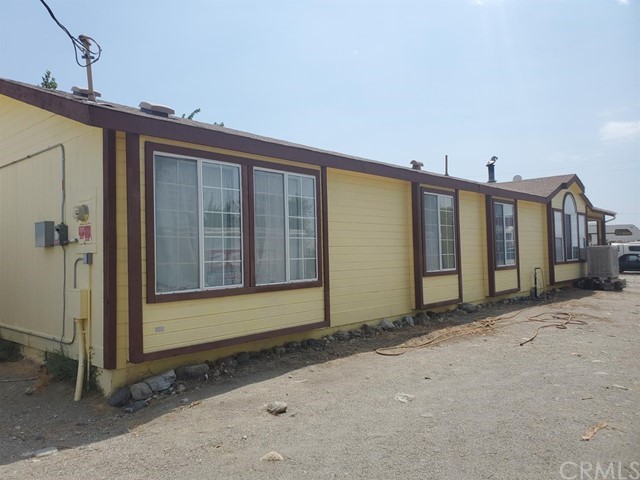 12285 Golden View Road Pinon Hills, CA 92372 - Photo 2 of 33 a view of a house with a backyard