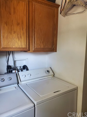 12285 Golden View Road Pinon Hills, CA 92372 - Photo 22 of 33 a utility room with dryer and washer