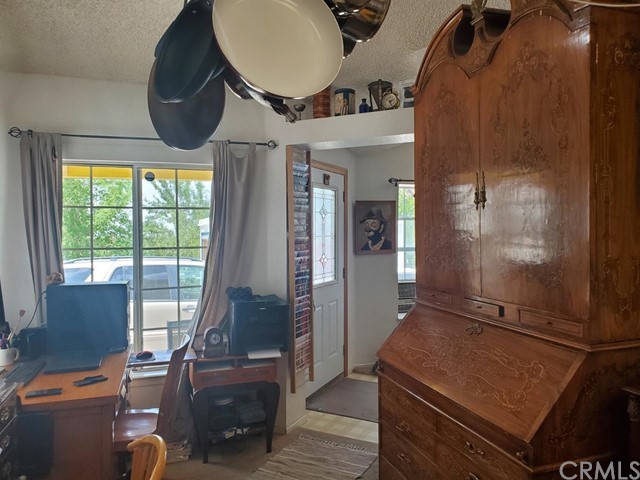 12285 Golden View Road Pinon Hills, CA 92372 - Photo 30 of 33 a room with furniture and wooden floor