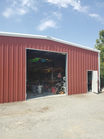 12285 Golden View Road Pinon Hills, CA 92372 - Photo 5 of 33 a view of a building with door and wooden fence