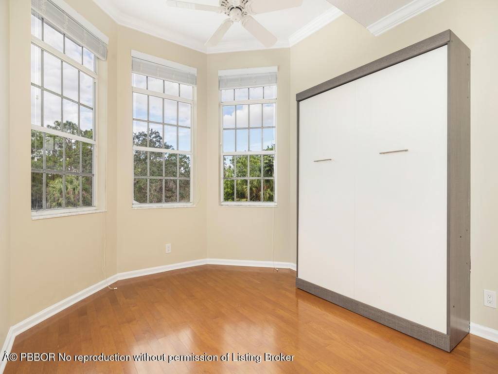 1001 Southeast Ranch Road Northeast Jupiter, FL 33478 - Photo 19 of 32 a view of an empty room with a window