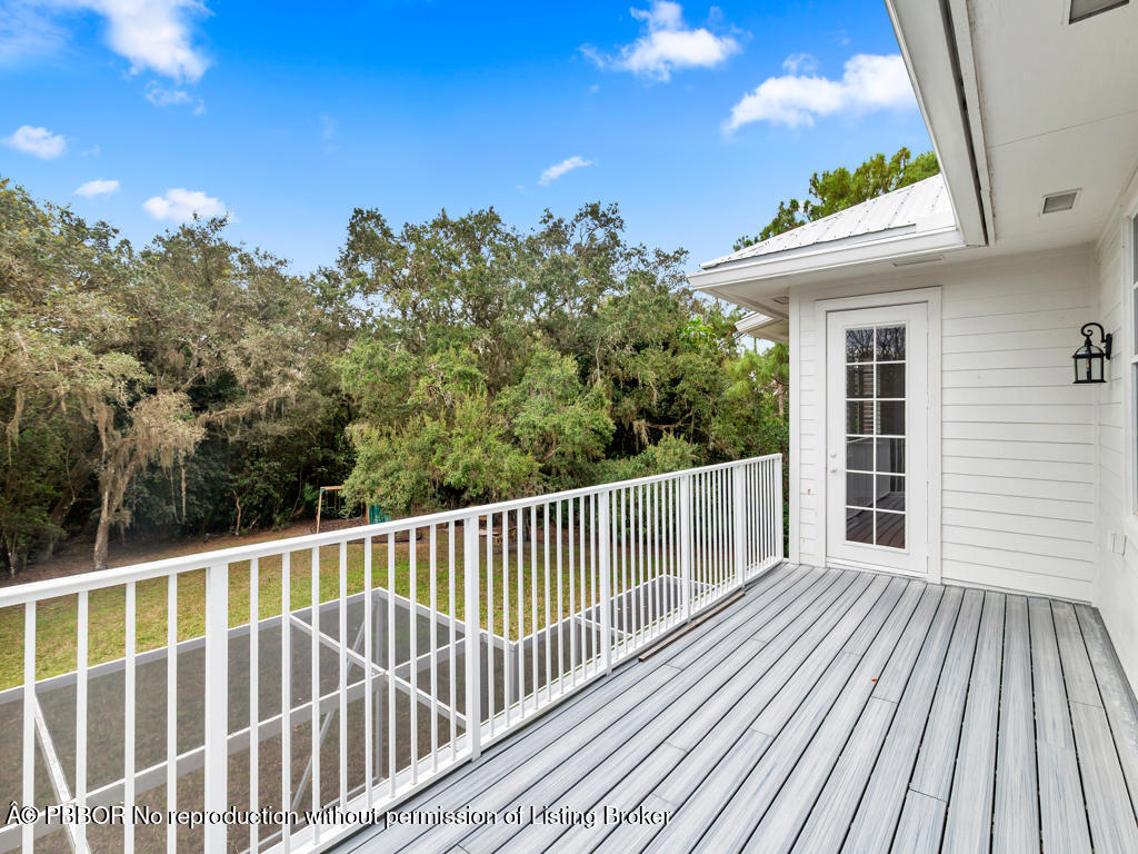 1001 Southeast Ranch Road Northeast Jupiter, FL 33478 - Photo 20 of 32 a view of a wooden deck