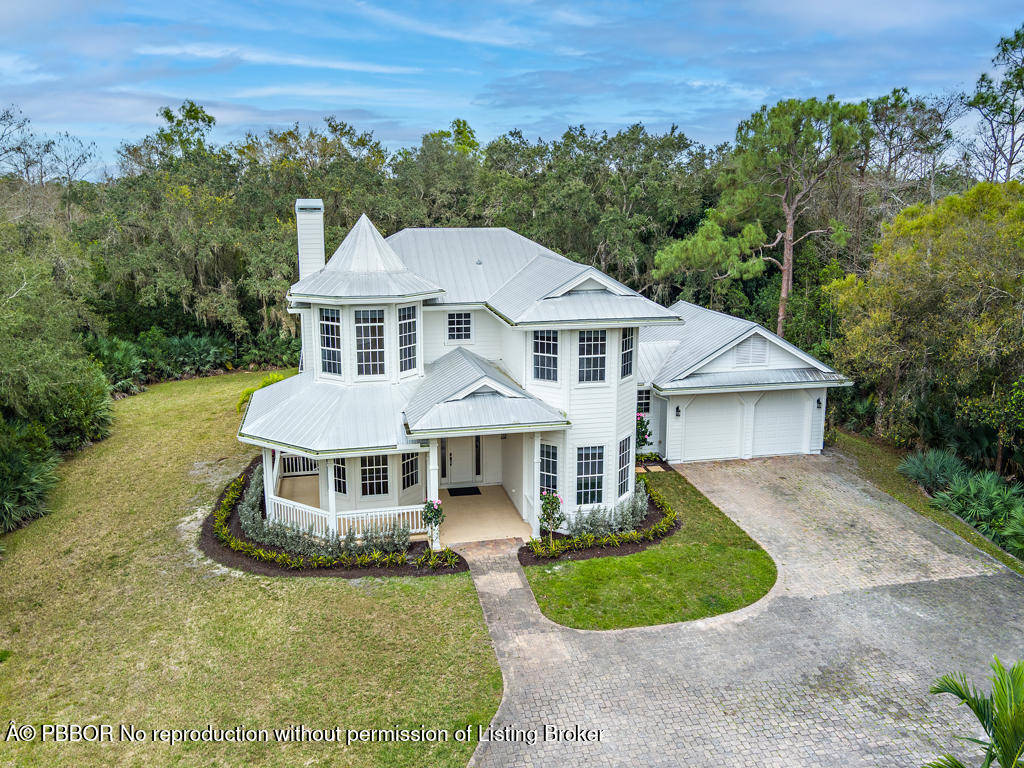 1001 Southeast Ranch Road Northeast Jupiter, FL 33478 - Photo 26 of 32 an aerial view of a house
