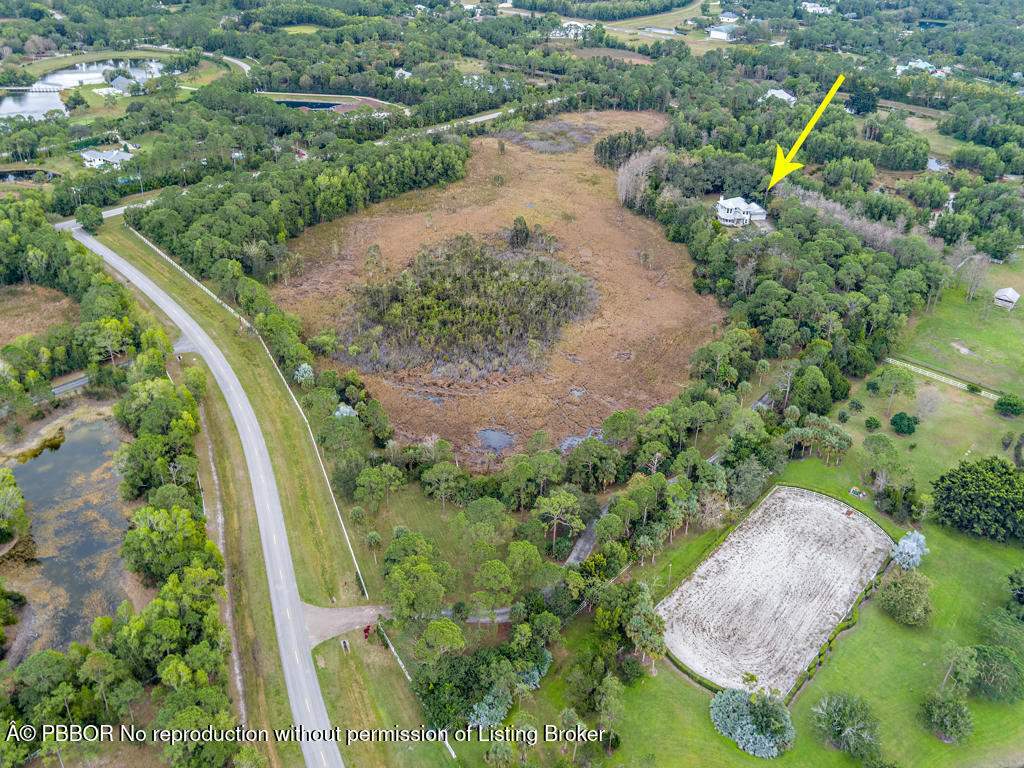1001 Southeast Ranch Road Northeast Jupiter, FL 33478 - Photo 32 of 32 an aerial view of a house