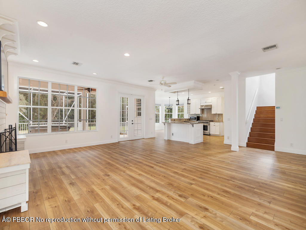 1001 Southeast Ranch Road Northeast Jupiter, FL 33478 - Photo 8 of 32 a view of kitchen with furniture and wooden floor