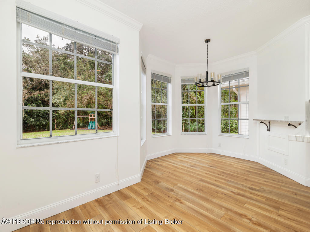 1001 Southeast Ranch Road Northeast Jupiter, FL 33478 - Photo 10 of 32 a view of an empty room with a window