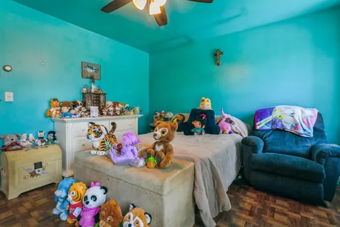 a bedroom with a bed and toys