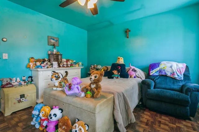 a bedroom with a bed and toys