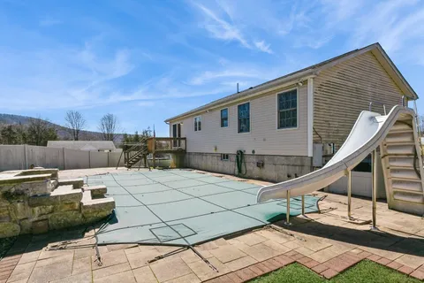 a house view with a backyard space
