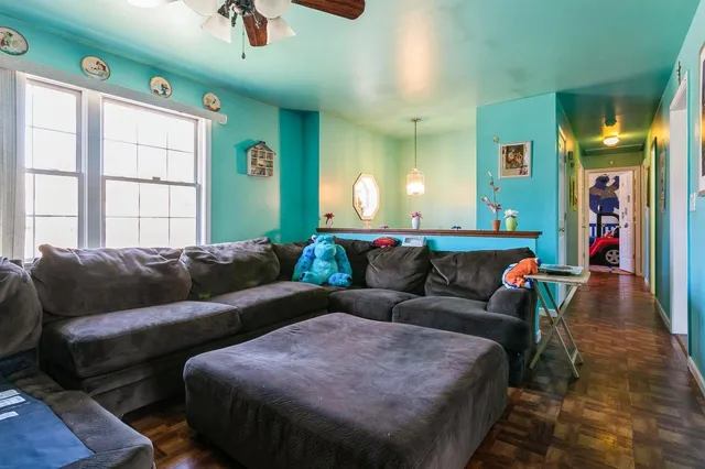 a living room with furniture and a window