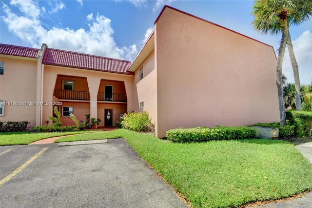 a room with pool table and chairs