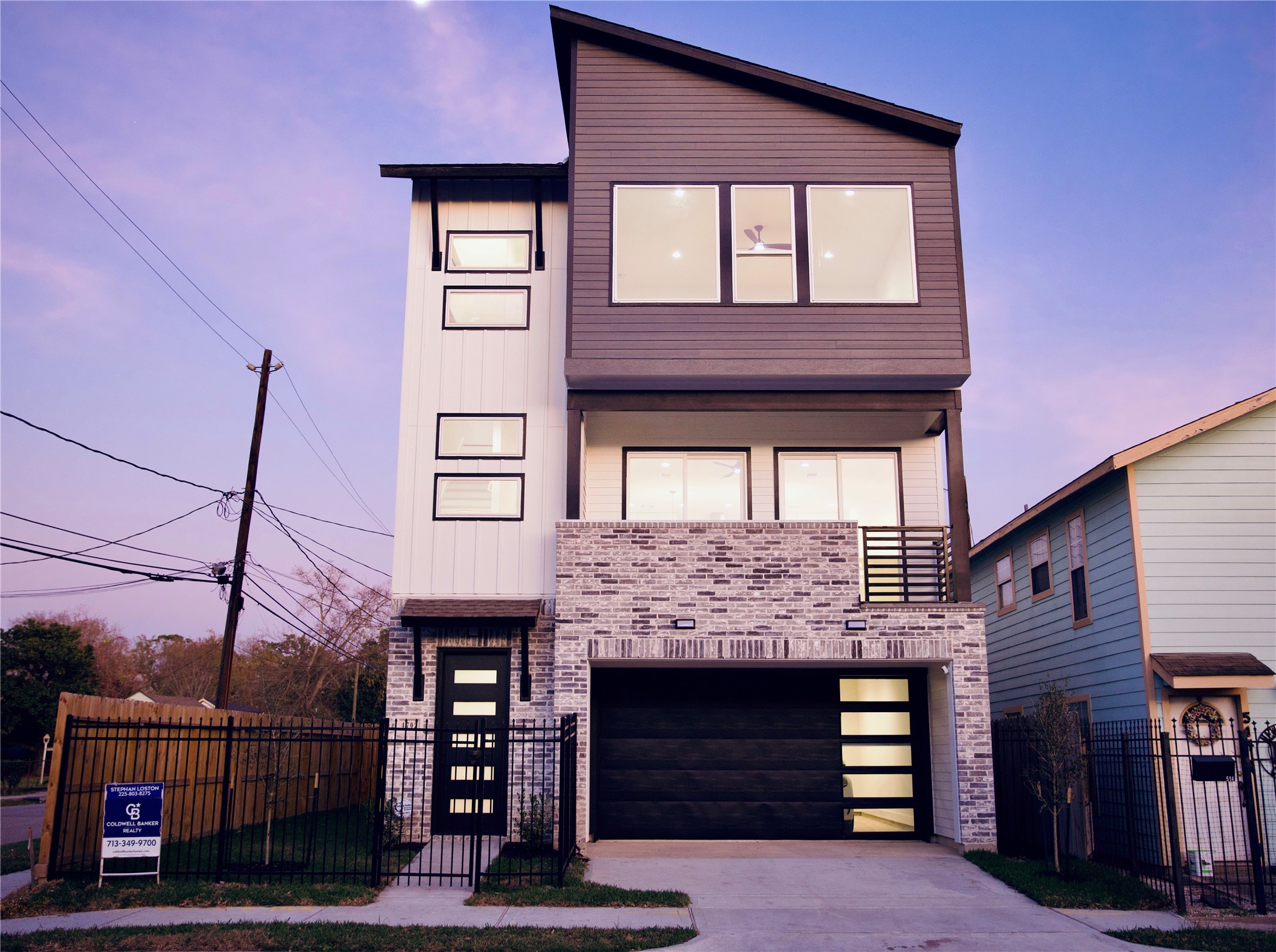 a front view of a house with garage