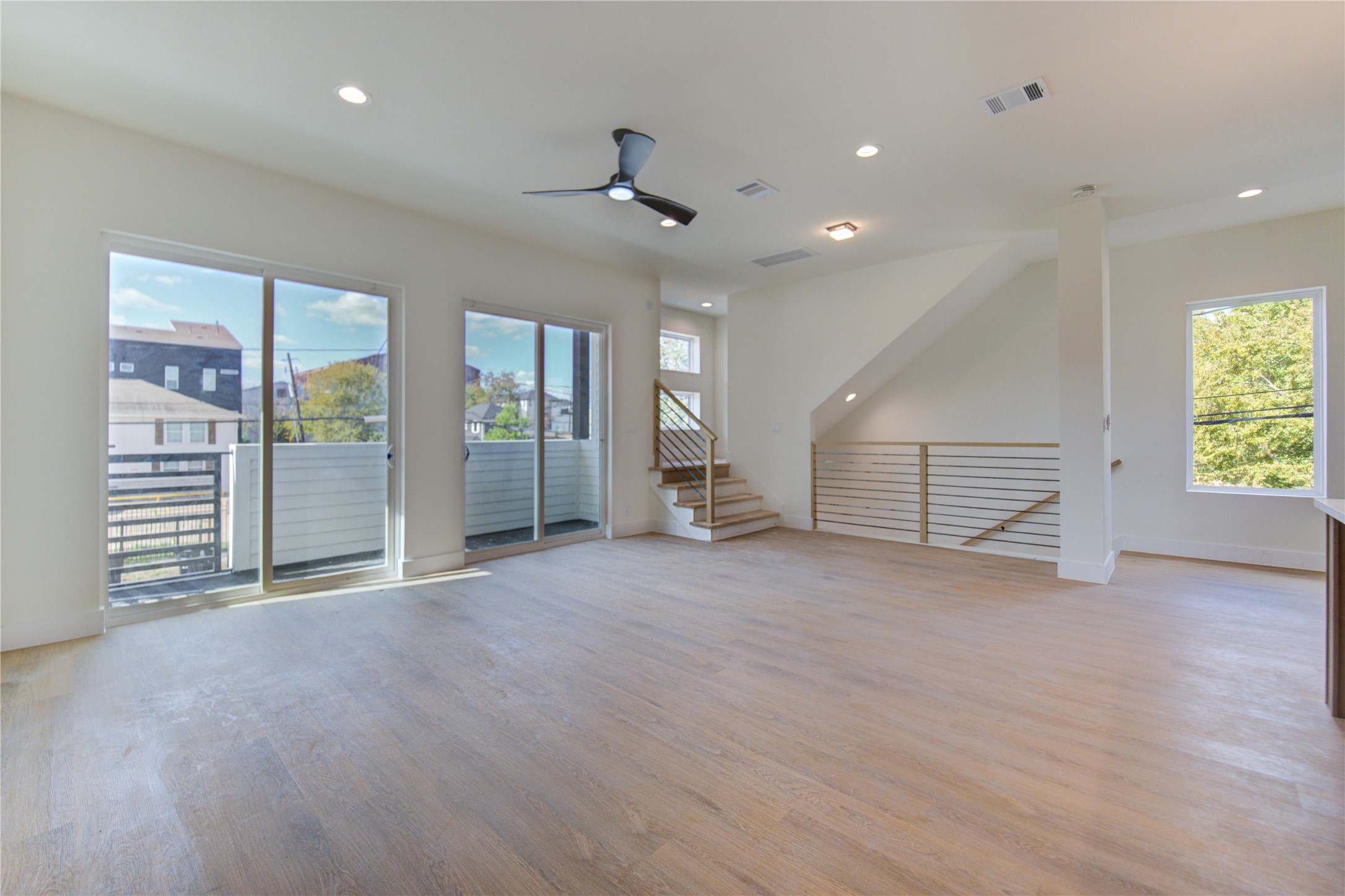 4702 Coke Street Houston, TX 77020 - Photo 14 of 35 an empty room with wooden floor and windows