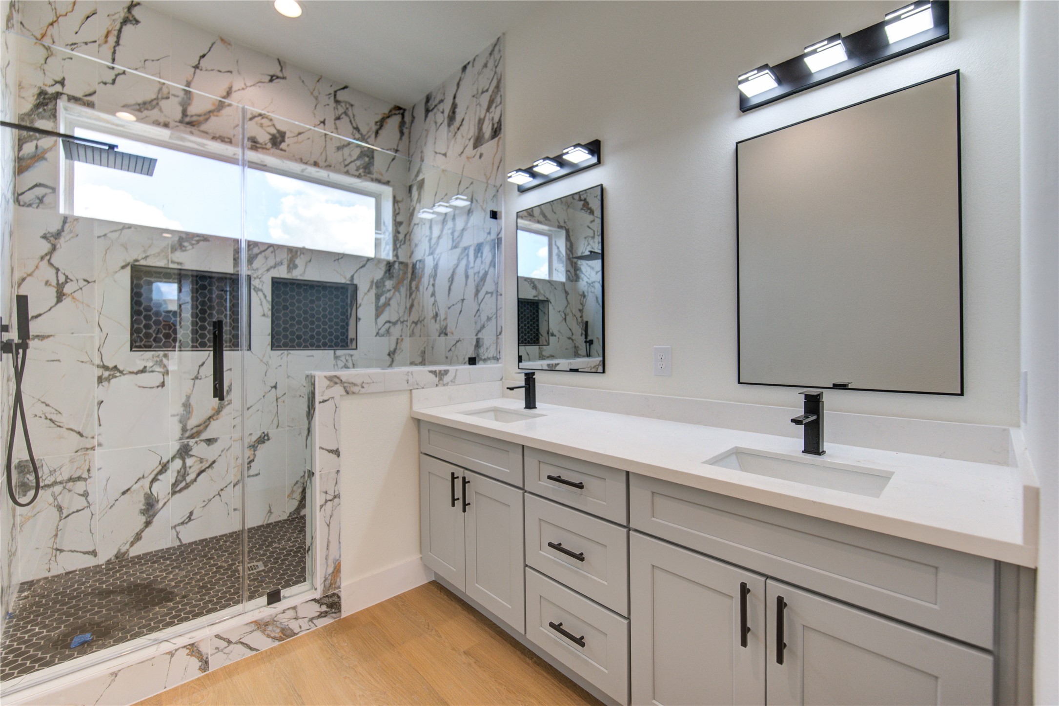 4702 Coke Street Houston, TX 77020 - Photo 18 of 35 a bathroom with double vanity sink and mirror