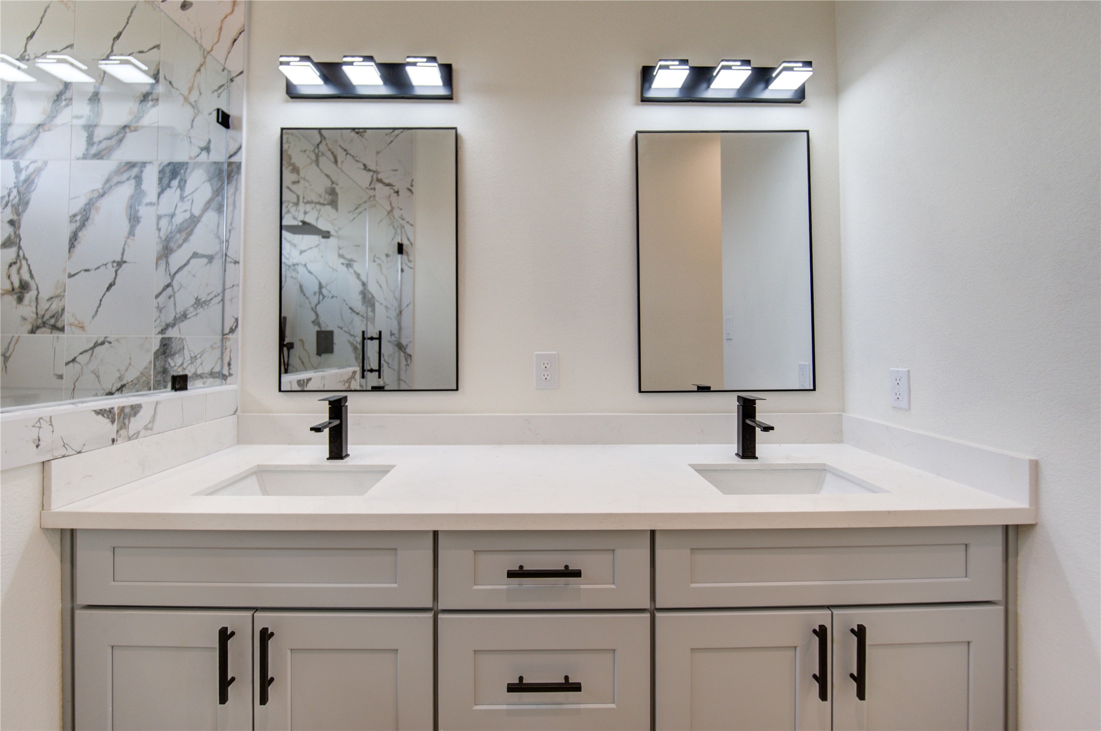 4702 Coke Street Houston, TX 77020 - Photo 19 of 35 a bathroom with double vanity sinks and a mirror