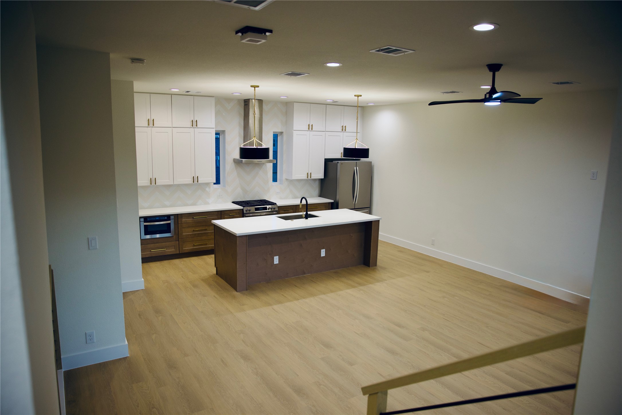 4702 Coke Street Houston, TX 77020 - Photo 4 of 35 a kitchen with stainless steel appliances granite countertop a sink stove and refrigerator