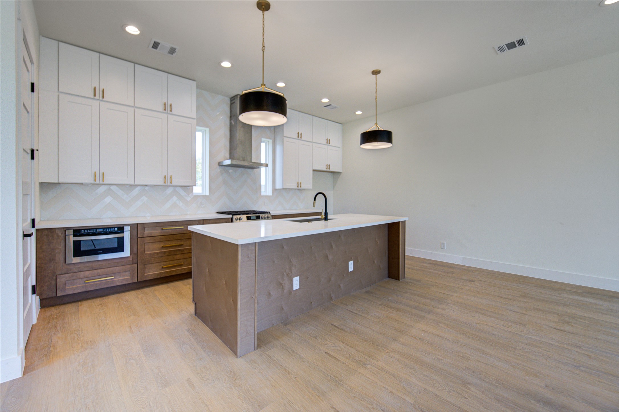 4702 Coke Street Houston, TX 77020 - Photo 6 of 35 a kitchen with stainless steel appliances granite countertop a sink a stove and a refrigerator
