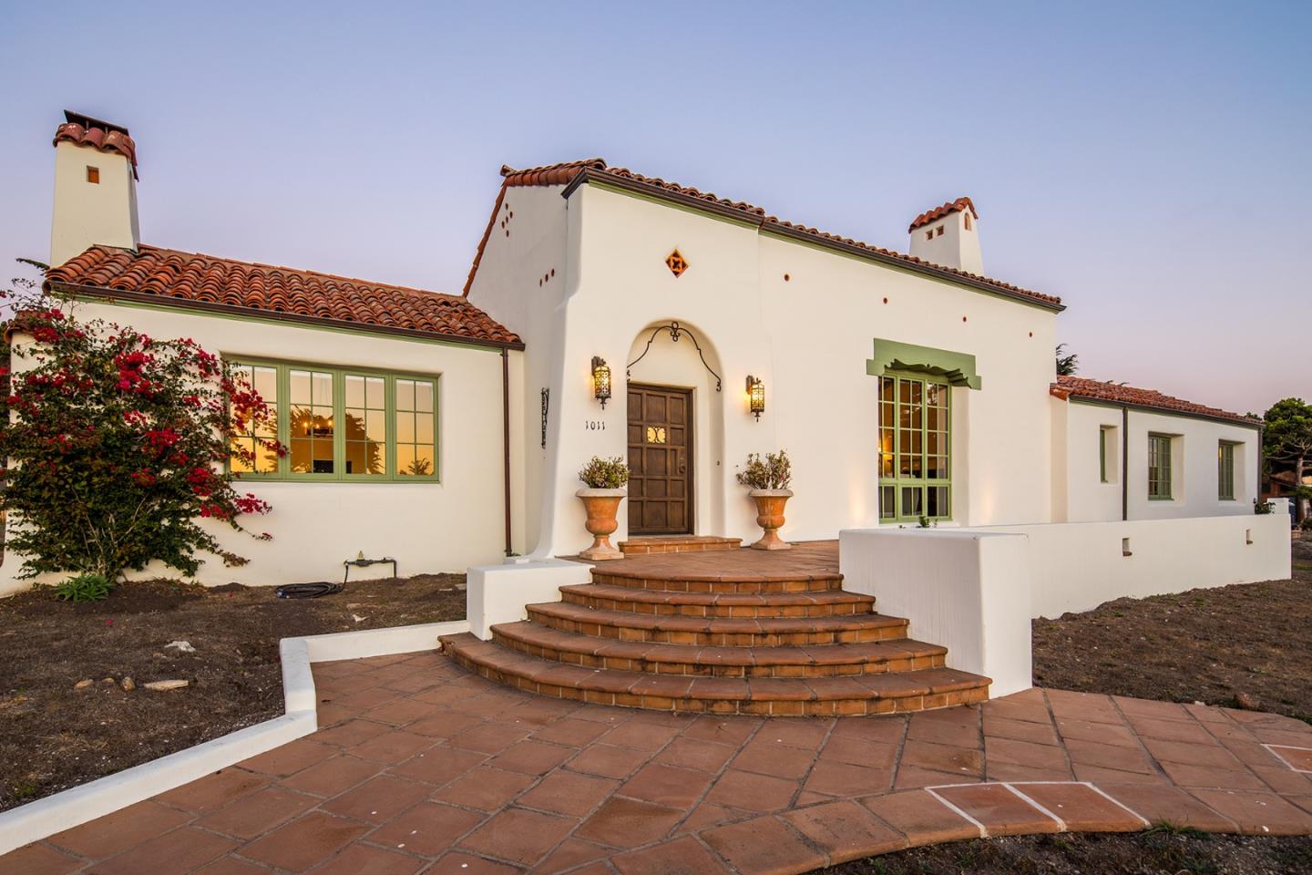 1011 Rodeo Road Pebble Beach, CA 93953 - Photo 2 of 41 a front view of a house with a yard
