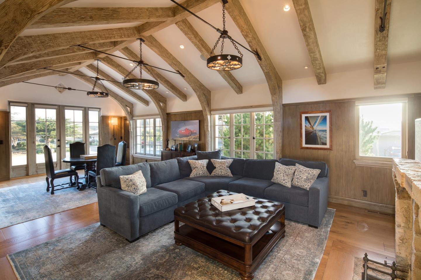 1011 Rodeo Road Pebble Beach, CA 93953 - Photo 20 of 41 a living room with furniture and a large window