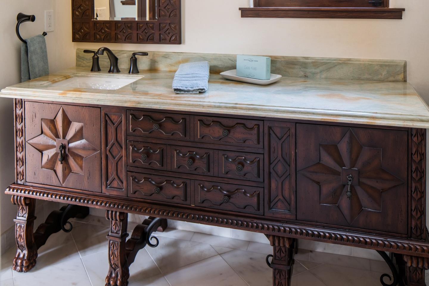 1011 Rodeo Road Pebble Beach, CA 93953 - Photo 31 of 41 a kitchen with a cabinets and a sink