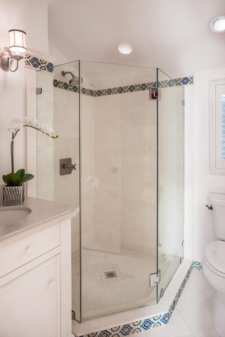 1011 Rodeo Road Pebble Beach, CA 93953 - Photo 33 of 41 a bathroom with a shower a mirror and a shower