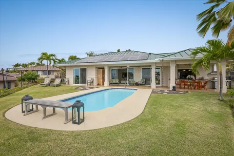 a view of a house with pool porch and chairs