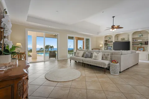 a living room with furniture and a dining table