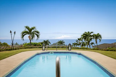 a view of swimming pool with outdoor seating and yard