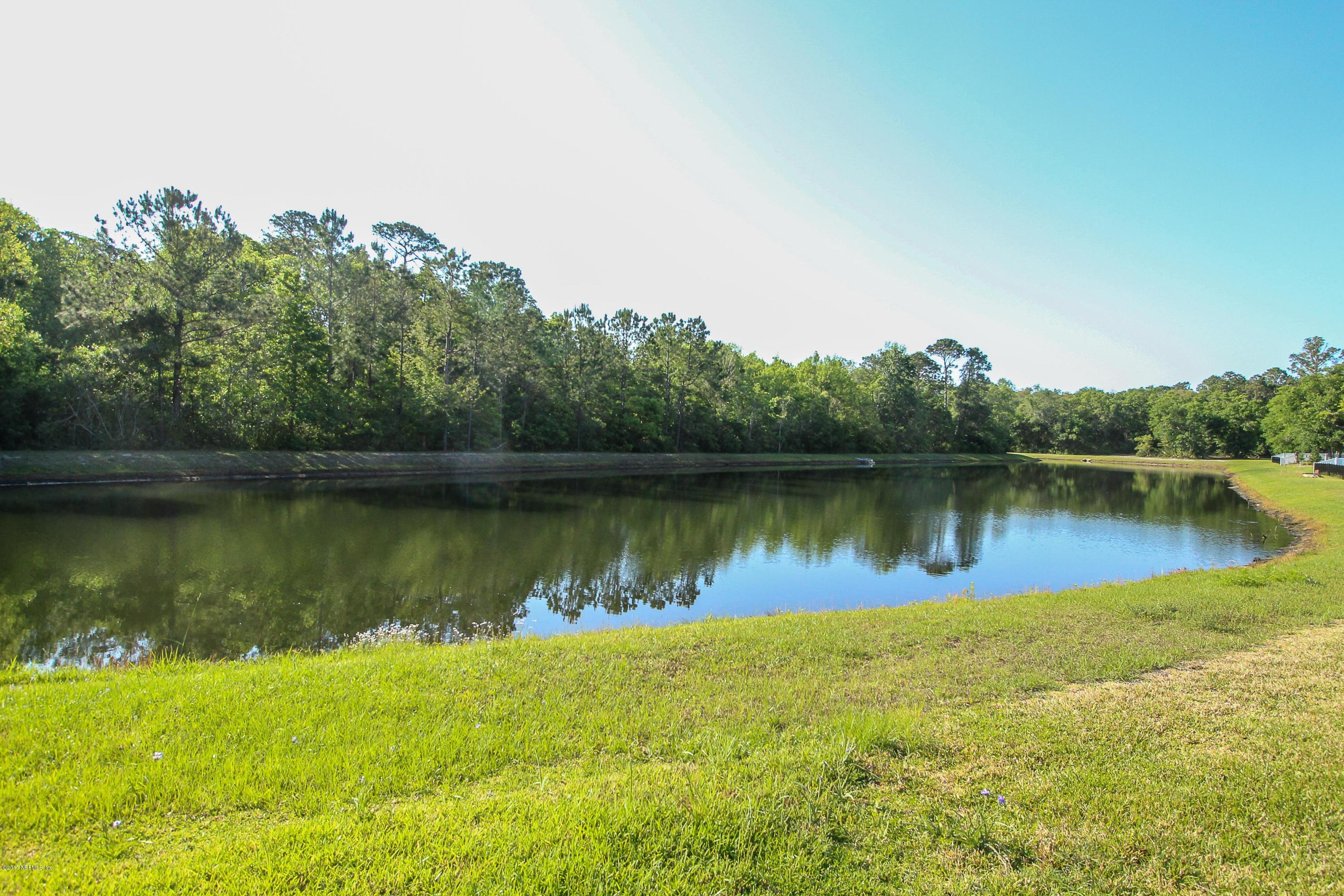 88442 Maybourne Road Yulee, FL 32097 - Photo 24 of 29 a view of a lake