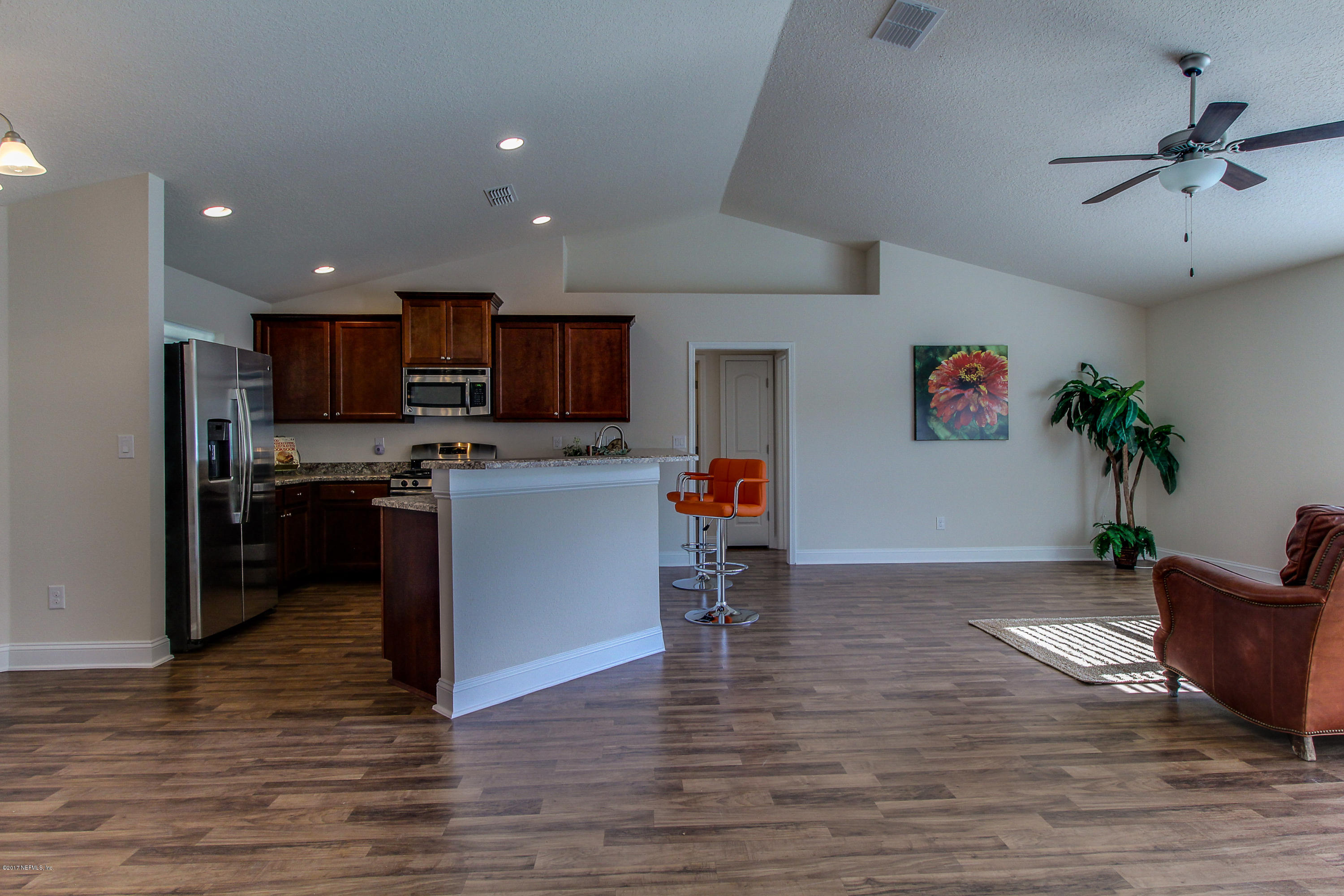 88442 Maybourne Road Yulee, FL 32097 - Photo 4 of 29 a living room with furniture and kitchen