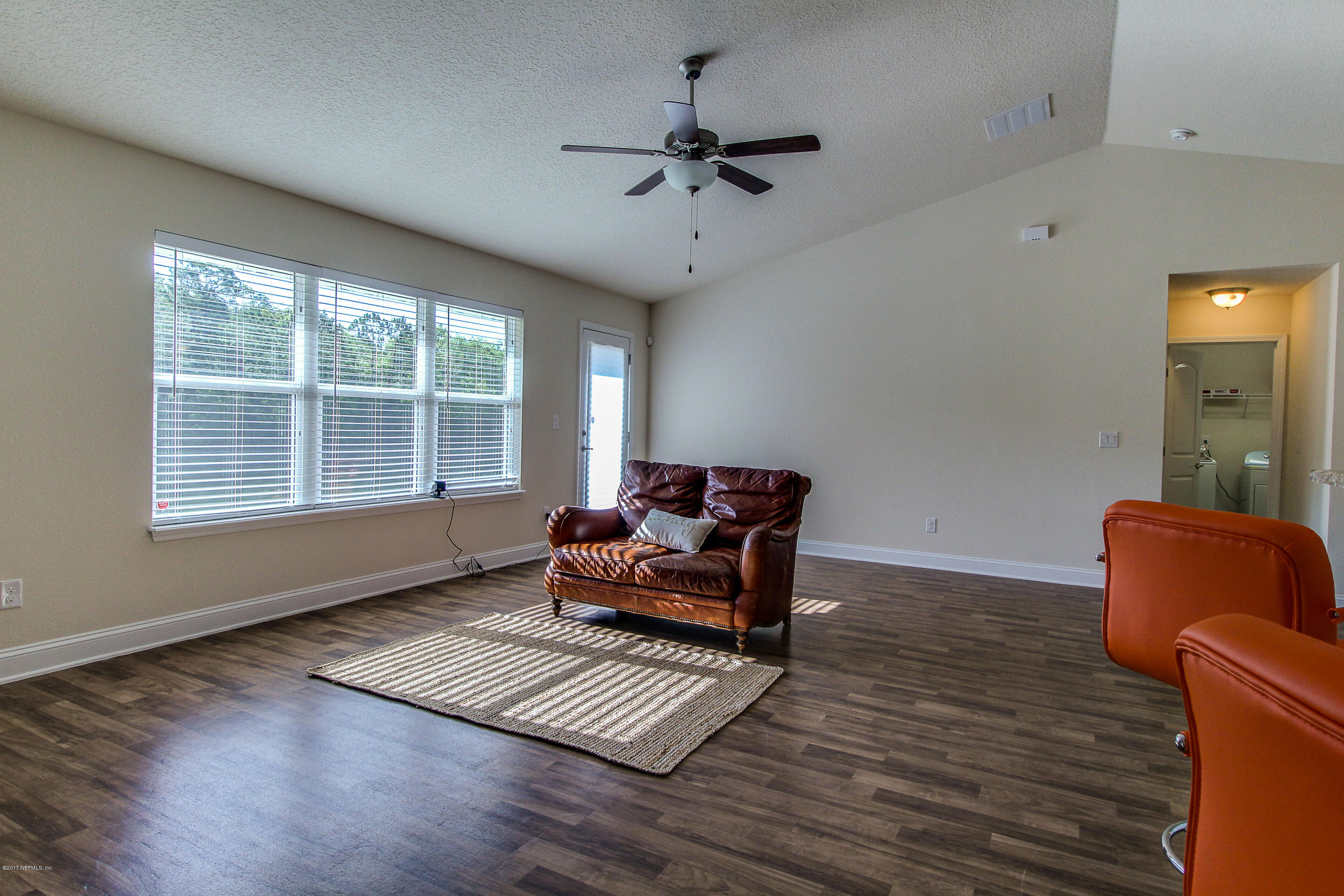 88442 Maybourne Road Yulee, FL 32097 - Photo 10 of 29 a living room with furniture and a window