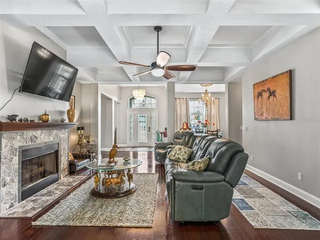a living room with furniture and a fireplace