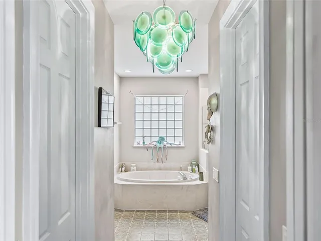 a bathroom with bathtub and shower