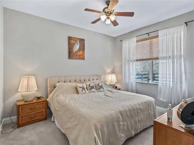 a white toilet sitting next to a bathroom sink and a shower