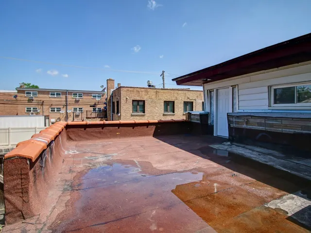 a swimming pool with outdoor seating