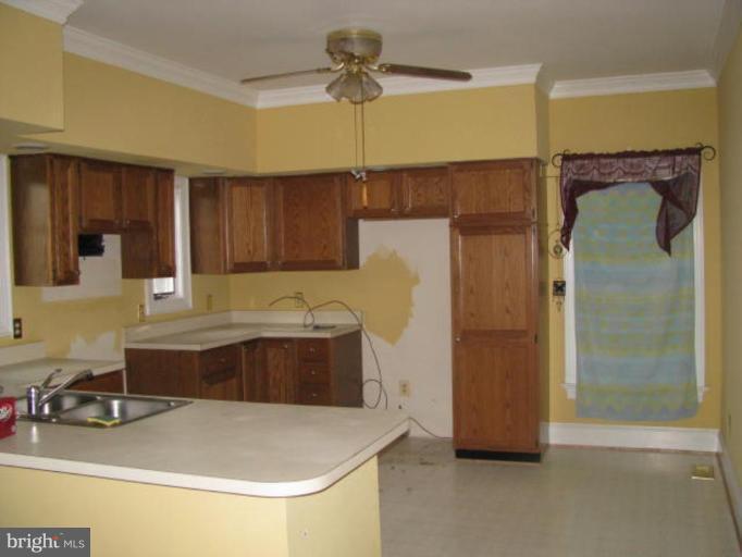 8388 Old Stillhouse Road Rixeyville, VA 22737 - Photo 12 of 15 a kitchen with a refrigerator and a sink