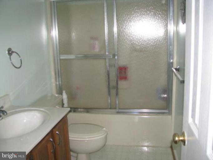 8388 Old Stillhouse Road Rixeyville, VA 22737 - Photo 13 of 15 a bathroom with a granite countertop sink toilet and shower