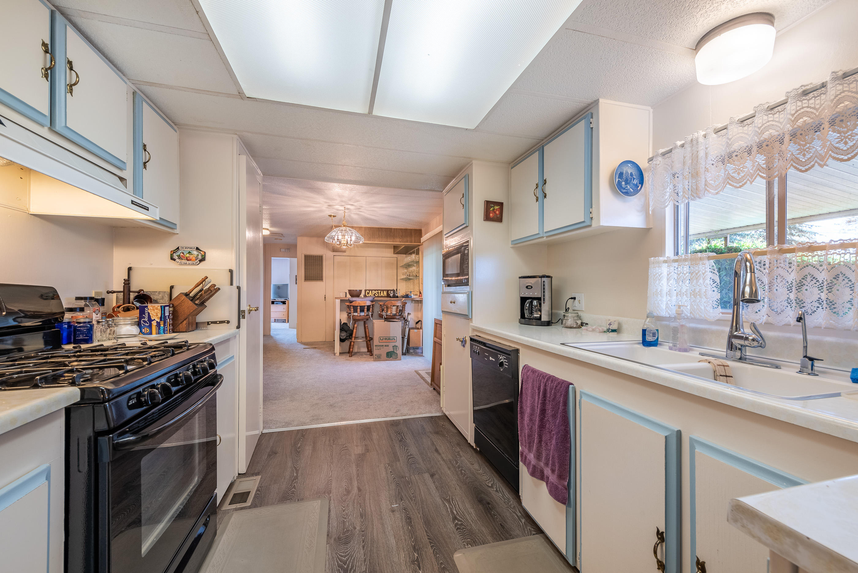 3950 Via Real, Unit 129 Carpinteria, CA 93013 - Photo 11 of 35 a kitchen with stainless steel appliances granite countertop a sink stove and refrigerator