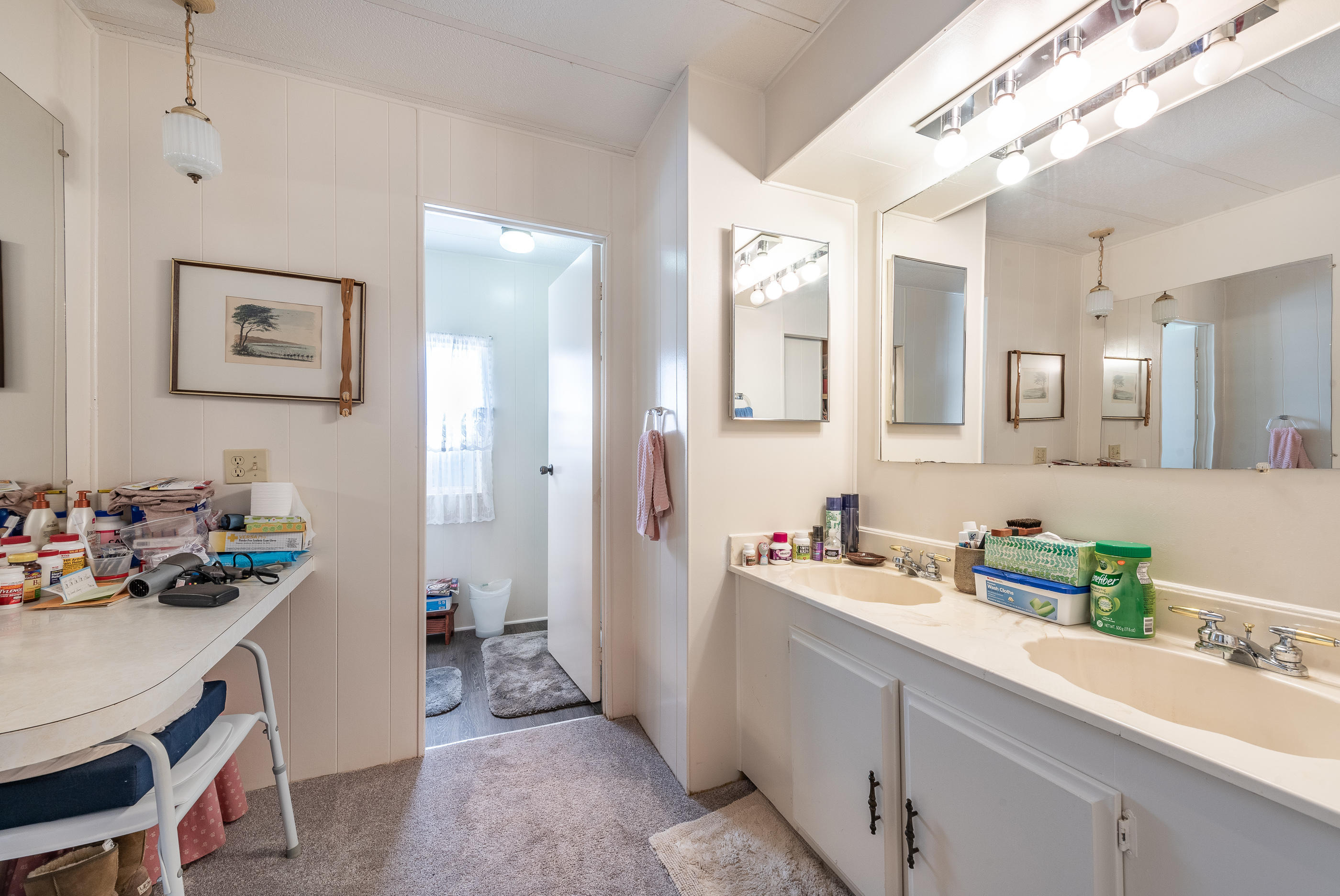 3950 Via Real, Unit 129 Carpinteria, CA 93013 - Photo 19 of 35 a bathroom with a sink mirror and vanity