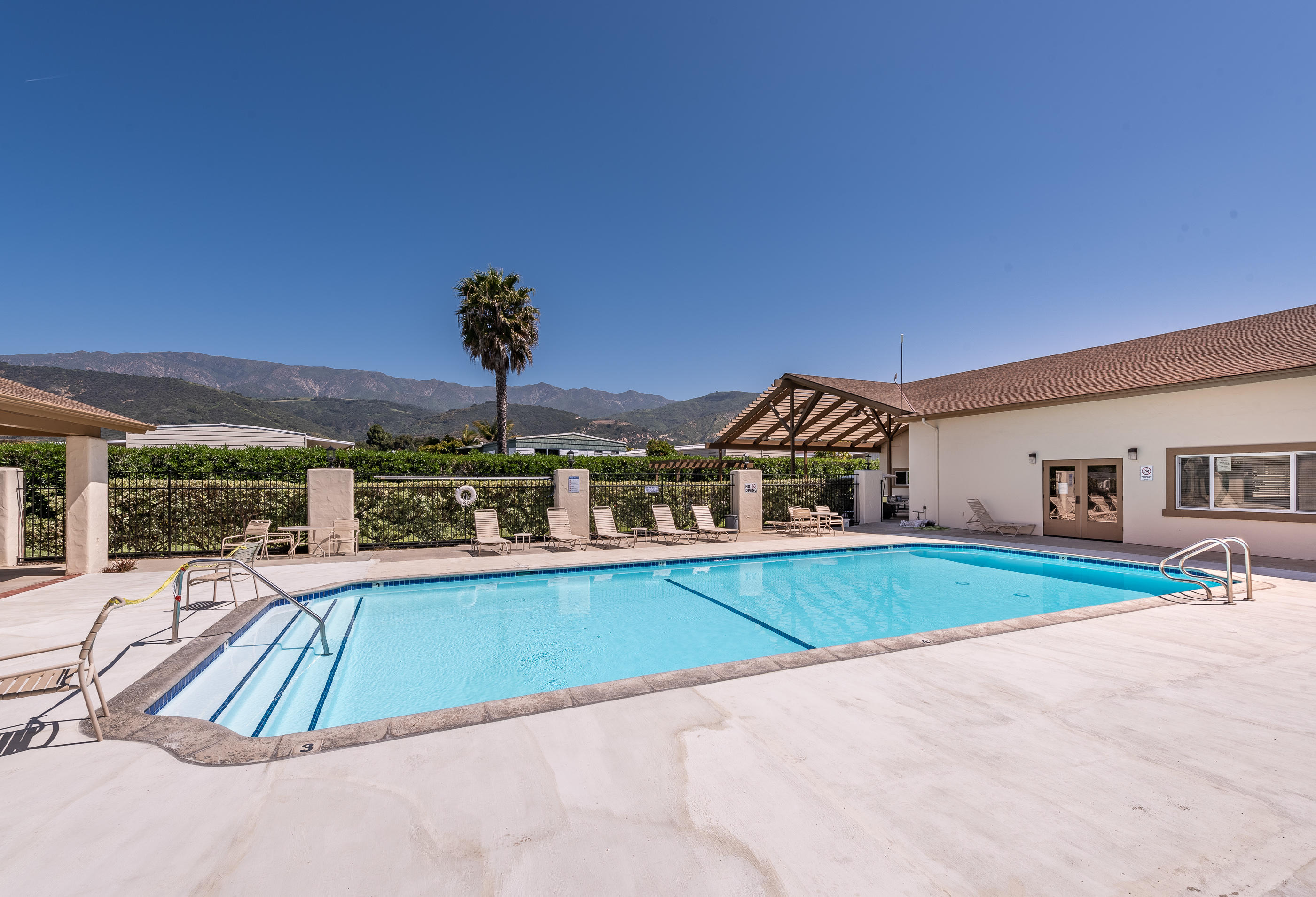 3950 Via Real, Unit 129 Carpinteria, CA 93013 - Photo 29 of 35 a view of a house with swimming pool and a yard