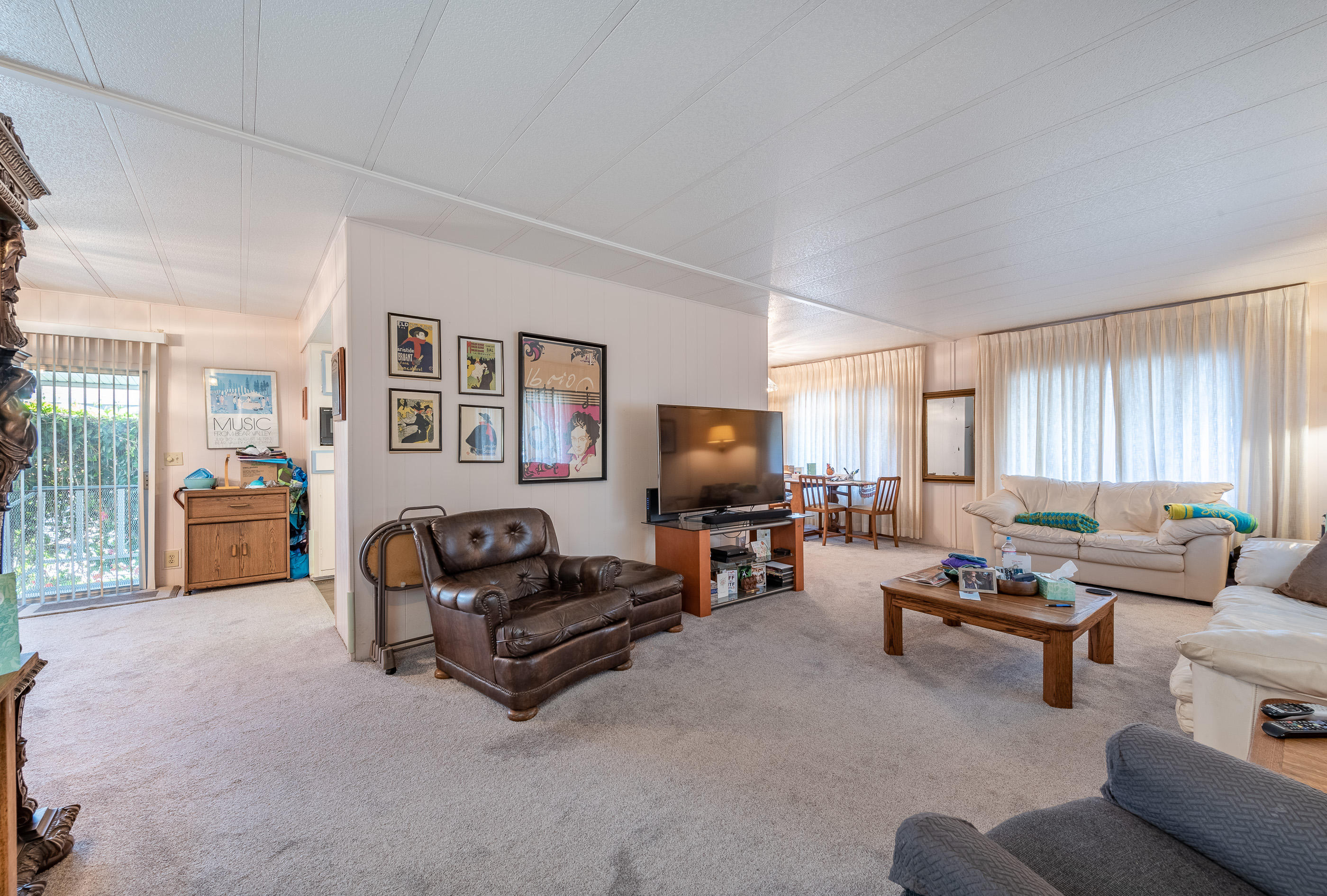 3950 Via Real, Unit 129 Carpinteria, CA 93013 - Photo 7 of 35 a living room with furniture and a flat screen tv